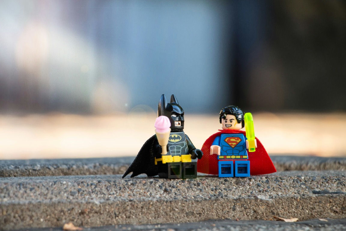 Brick-built superhero figures on display